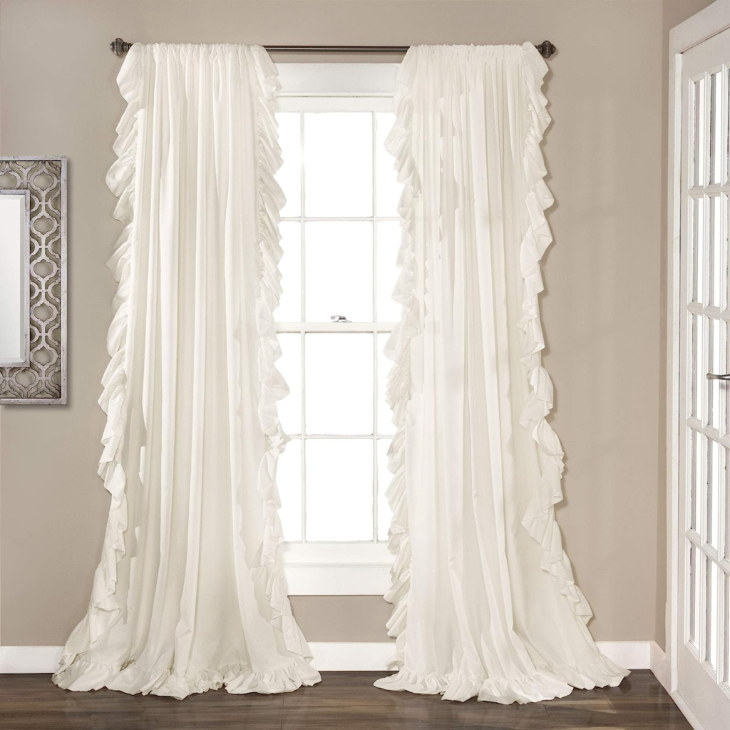 Lace curtains in a classic pattern, softly diffusing natural light and adding a sense of sophistication to the space.