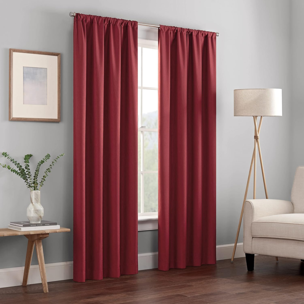 Bright red curtains adding energy to a living room.

