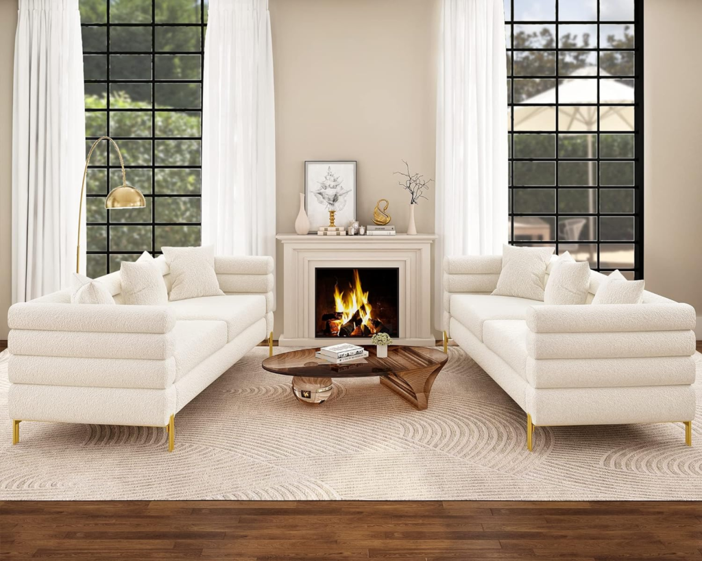 A white leather sofa with chrome legs against a neutral backdrop.

